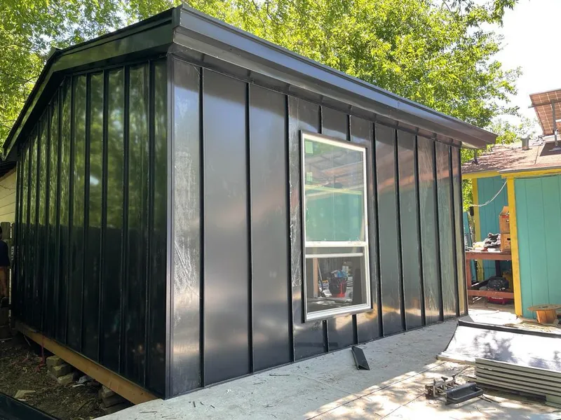 Black standing seam metal wall panels for Roof Inspection in Conway